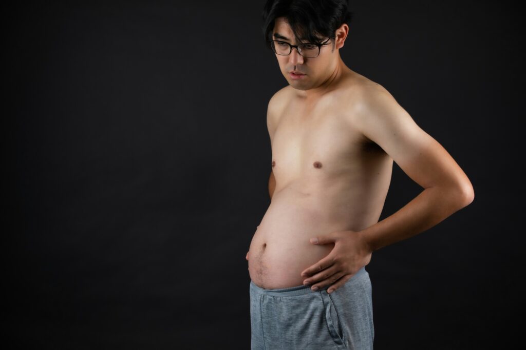 A man with gas and bloating in his belly